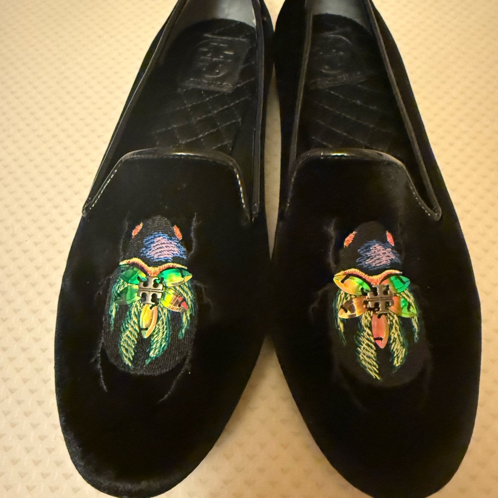 Tory Burch Brand New Velvet Black Slip-on Flats with Multicolor Beetle Emblem.